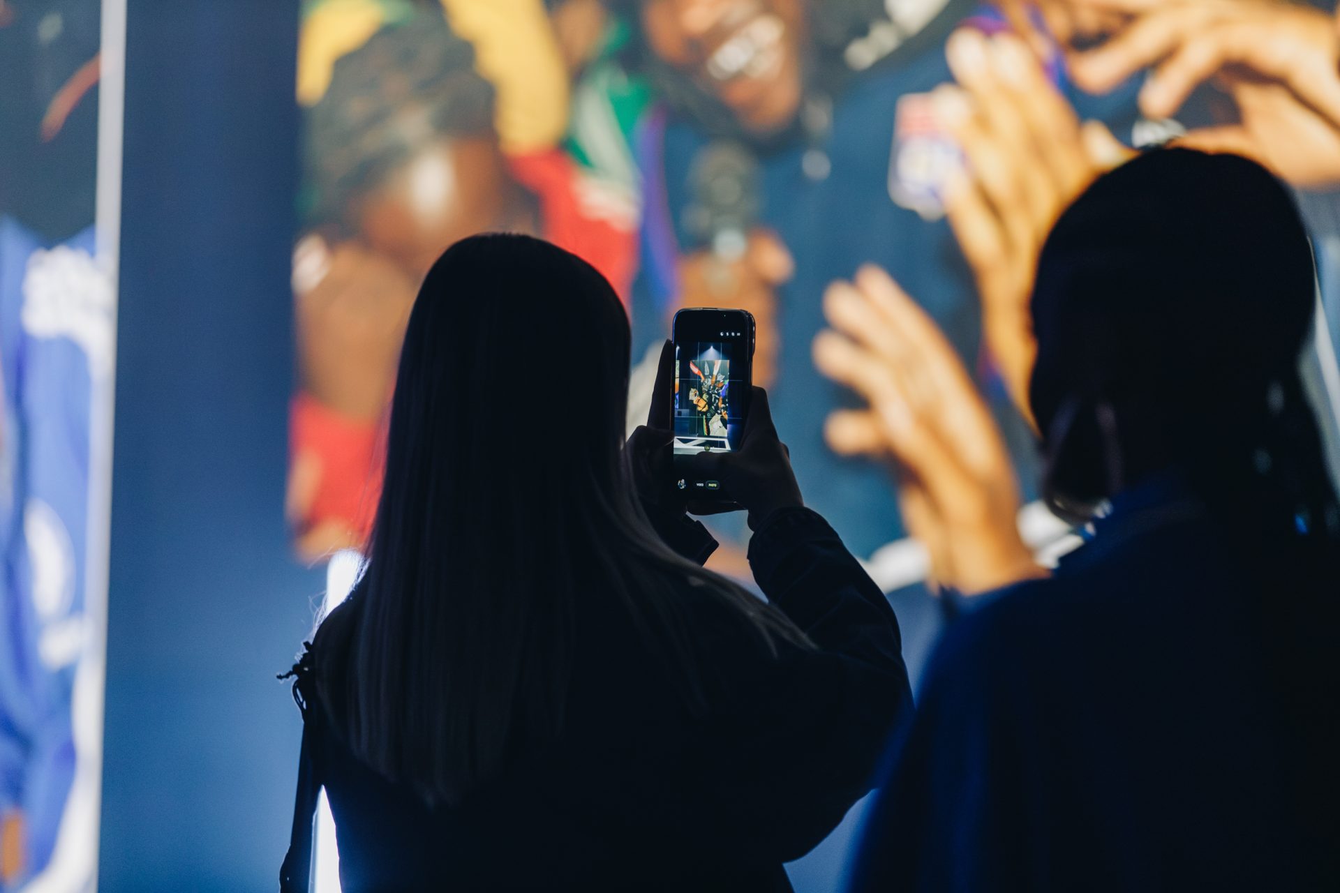 Visitors exploring the Common Frequency exhibition at Aviva Studios